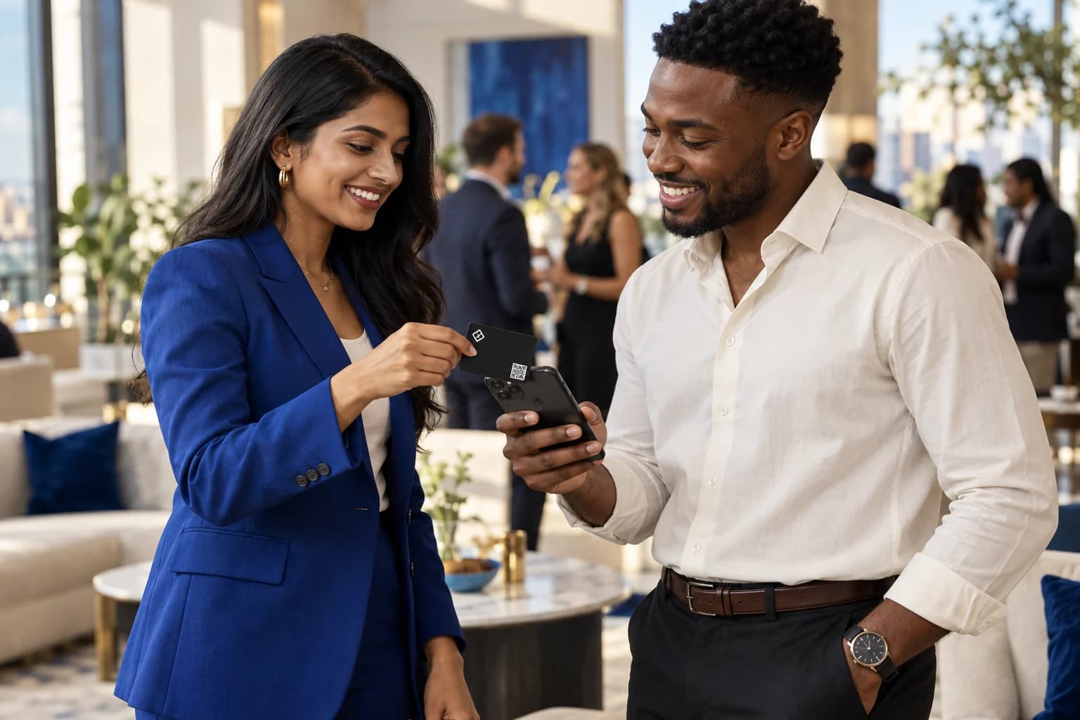 Two professionals demonstrating a G-tap card held near a smartphone during an introduction